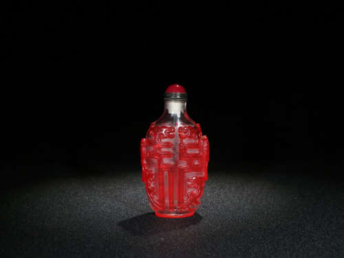 A COLORED GLASS SNUFF BOTTLE WITH CHILONG PATTERNS