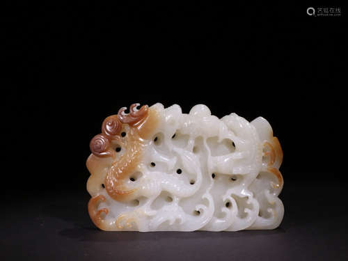 A HETIAN JADE CARVED DRAGON PATTERN ORNAMENT