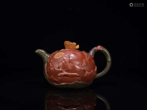A ZISHA TEAPOT IN BUTTERLY AND FLOWER PATTERNS
