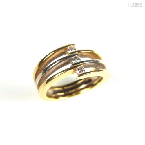 Yellow gold tri-band diamond crossover ring.