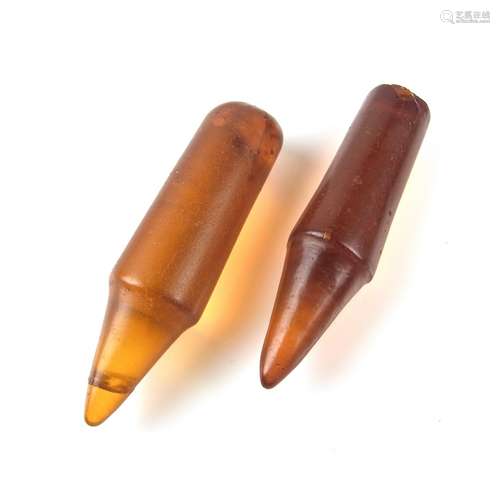 A pair of amber ear plugs, Kachin People, Burma, 19th/early 20th century.