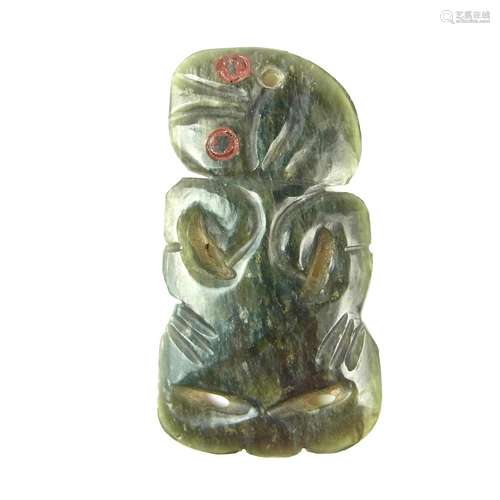 Tribal Art: A Maori carved jade tiki hei pendant, New Zealand, probably late19th/early 20th century.