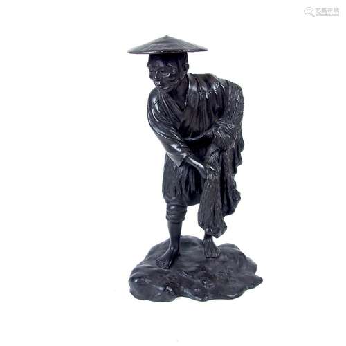 A Japanese cast bronze figure of a fisherman, probably late Meiji/Taisho period (1868 - 1926).