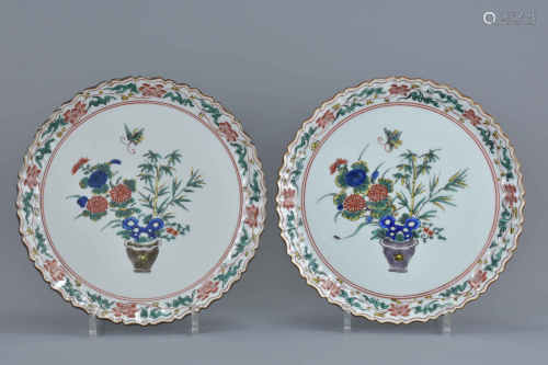 Pair of Japanese Plates with Fluted Edges decorated with a display of flowers and bamboo in a vase w