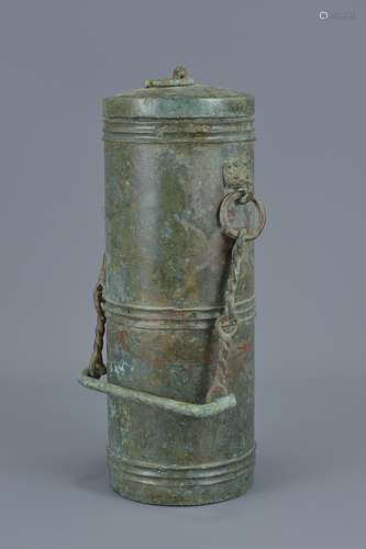 A Chinese Han dynasty 206BC – 220 AD bronze vessel with chain handle and handle. 27Cm tall. Provenan