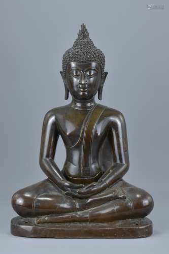 A Thai 18/19th century seated dark bronze figure of seated Buddha. 49Cm tall