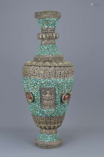 A large Tibetan silver-coloured metal vase inserted with turquoise stone decorated with lion  and Bu