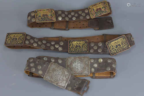 Three Eastern Leather Studded Belts with Bronze Tiger Panels, possibly Indian, largest approx. 101 c