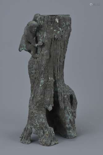 A tall Japanese Meiji period bronze sculpture pot in the form of a tree trunk with monkey holding a