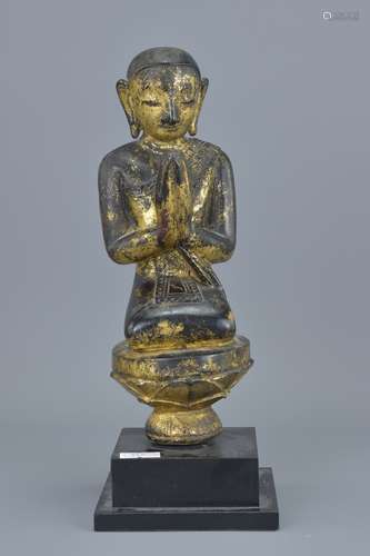 19th century Thai Wooden Carved Kneeling Buddha with traces of Gold Gilding, 23cms high