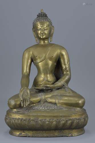 A Tibetan bronze seated medicine buddha. 40cm tall