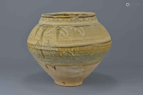 A Chinese 12/13th century pottery jar with unusual glazing. Decorated with floral motifs and a brown