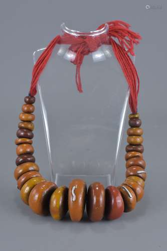 Large Moroccan Amber resin bead Necklace with silver inserts. 5cm largest bead