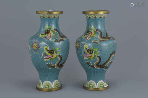 A pair of Chinese cloisonné enamel vases decorated with dragons. 22Cm tall (2)