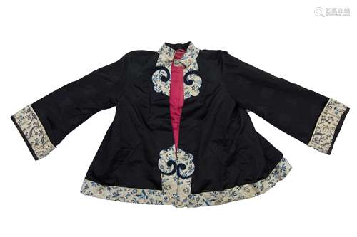 A Chinese 20th century silk embroidered jacket. 68cm tall