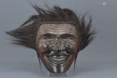 A large Japanese carved wooden ceremonial mask. 29cm x 25cm