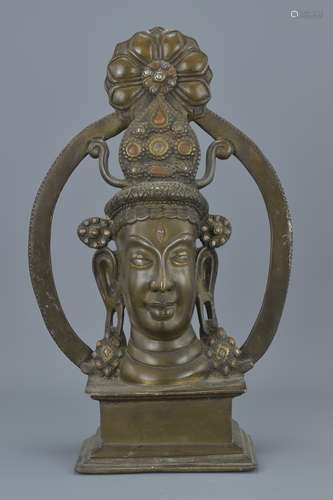 An Eastern bronze figure on stand. 37Cm tall