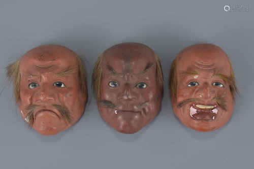 Three Japanese Papier Mache Lacquered and Painted Miniature Face Masks of Gentlemen with applied hai