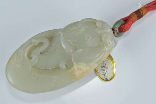 A large Chinese pale celadon jade pendant carved with monkey and whale. 9Cm x 4.5cm