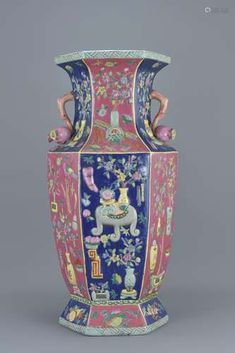 A large Chinese 20th century porcelain vase decorated with potted plants and trees . 53Cm tall