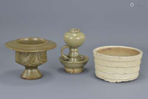 A Chinese Ming dynasty white glazed pottery censer together with two celadon oil lamps. 13.5cm diame