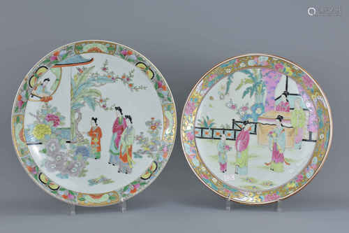 Two Japanese Porcelain Charges decorated in the famille rose palette depicting figures in garden set