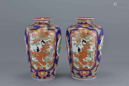 A pair of Japanese Imari porcelain vases decorated with figures in a garden and Kilin to reverse. 29