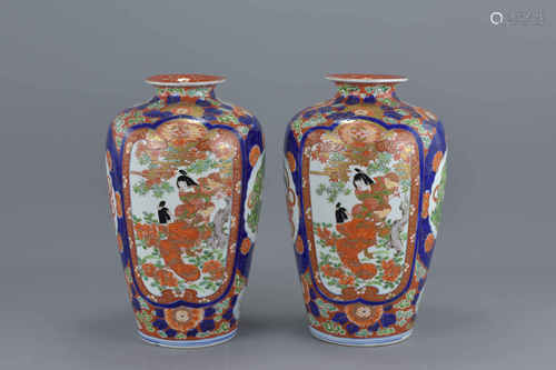 A pair of Japanese Imari porcelain vases decorated with figures in a garden and Kilin to reverse. 29