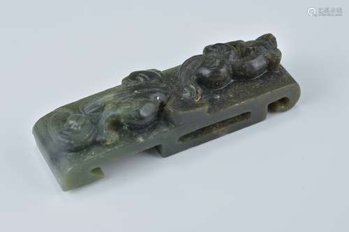 A Chinese dark green jade sword slider carved with dragon. 9cm length