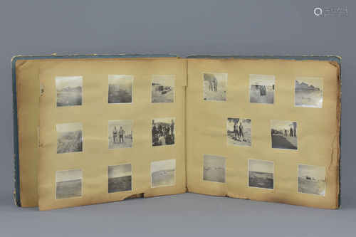 A collection of black and white photographs of Japanese World War II soldiers in an album with handw