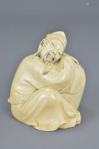 A Chinese late 19th century carved ivory figure of a sleeping scholar. Seal mark to base. 6.5cm tall