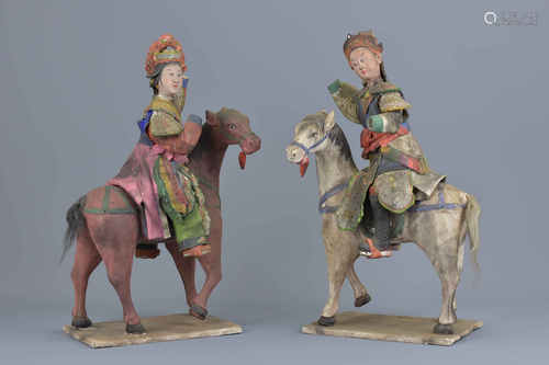 A pair of Chinese 19th century pottery horses and riders. 16cm x 30cm.