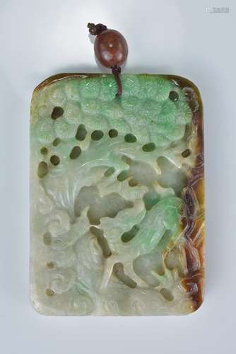 A Chinese pale celadon, green and russet jadeite pendant deeply carved with deer in forest and fish