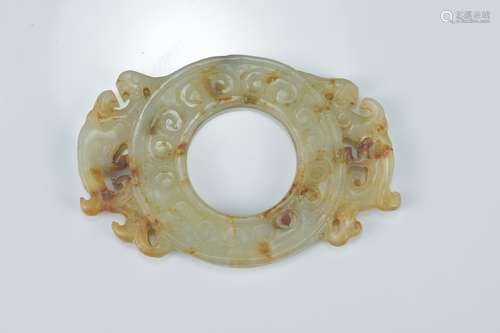 A Chinese green and russet jade pendant with two dragons. 5.5cm x 4cm