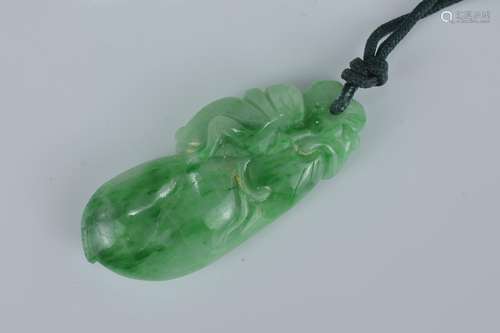 A Chinese green jadeite pendant carved with cricket on fruit with string. Size 3.5cm length