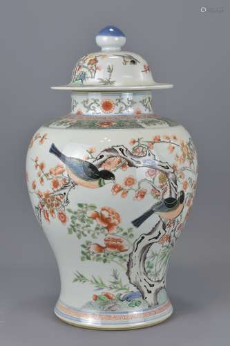 A Chinese 19th century famille rose porcelain vase and cover. Repair to rim. 44Cm tall