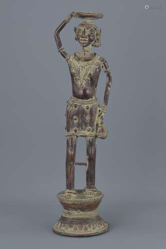 An Eastern standing bronze oil lamp figure. 43Cm tall