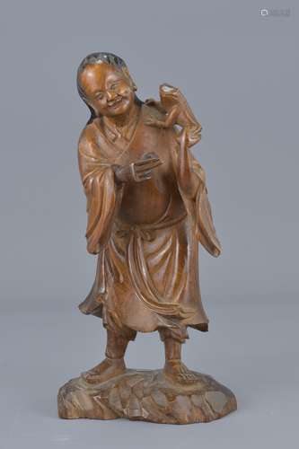 19th century Chinese Boxwood Carved Figure of Liu Haichan with Money Toad, 20cms high