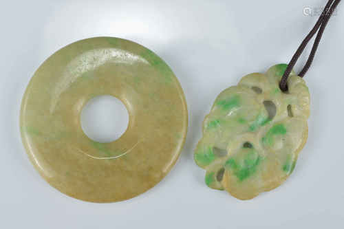 A Chinese jadeite greenish yellow disc together with a jadeite pendant carved as a peach. Disc 5.3cm