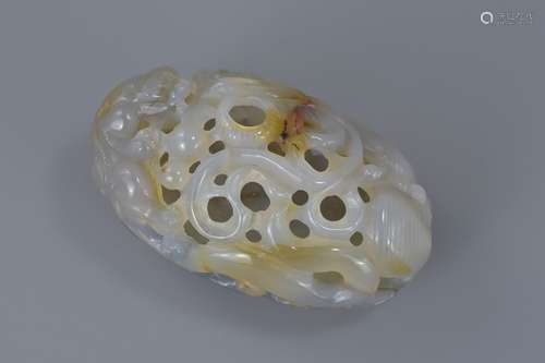 A Chinese agate hollow carving with dragon and lotus. 9cm x 5cm