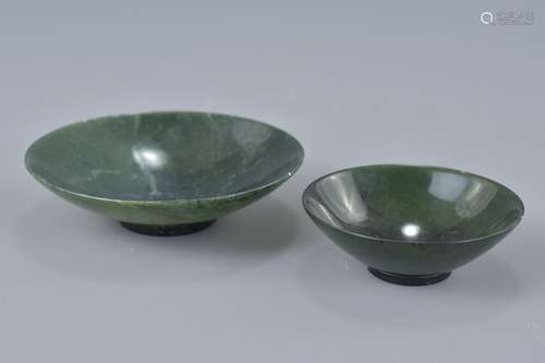 Two Chinese dark green spinach jade dishes. 9cm and 6.5cm diameters.