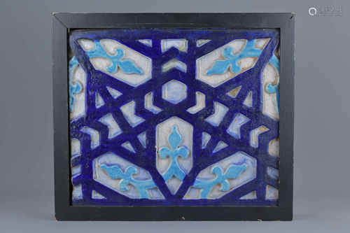 An antique Islamic pottery tile in wooden frame. 35M x 37cm