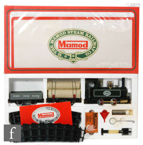 A Mamod RS1 live steam railway set, comprising locomotive, two items of rolling stock, track and accessories, boxed.