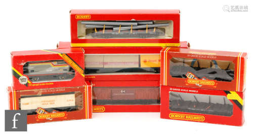 A collection of OO gauge Hornby rolling stock including steel carrier, crane truck, assorted wagons, etc. Boxed. (26)