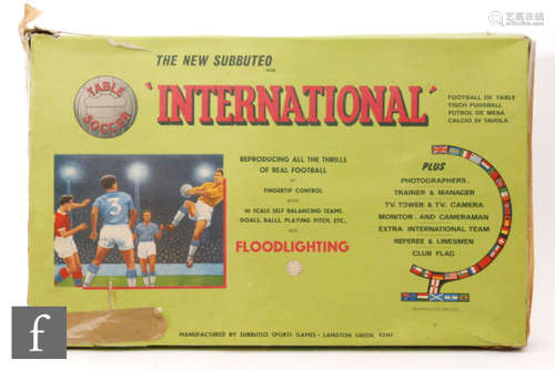 A collection of Subbuteo, including thirteen C100 teams including #77, #4, #21, #154, #102, etc., C131 Corner Kickers, C132 Throw-in Figures, FA Cup, World Cup Goals, two teams in partial boxes and assorted loose figures, etc., all contained in an International set box.