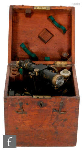 An early lacquered brass theodolite with accessories in mahogany fitted case, height 19cm