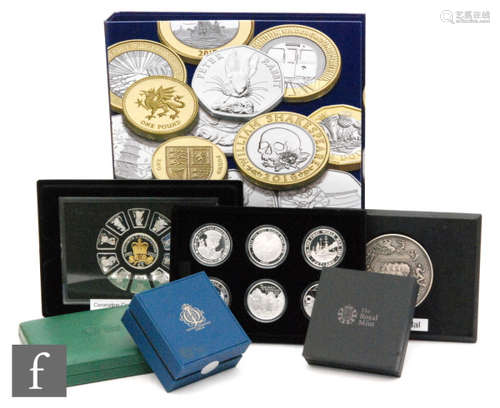 Elizabeth II - Two cases of World War One commemorative silver proof coins, a folder of proof ten pence coins, various single silver proof coins, silver ingots and various nickel and plated coinage (qty)