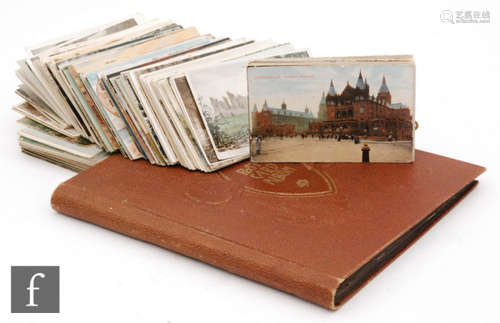 An album of Edwardian and later postcards and assorted loose cards featuring Blackpool, scenic views, etc. (qty)