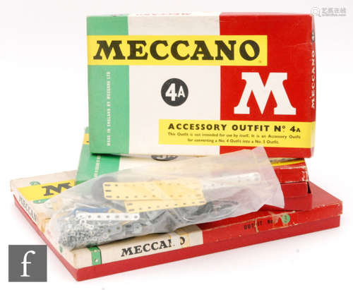 A collection of boxed Meccano sets, comprising Outfit No. 3, Accessory Outfit 3A, Accessory Outfit 4A and Accessory Outfit 5A, together with a selection of loose blue and yellow pieces and other parts. (qty.)