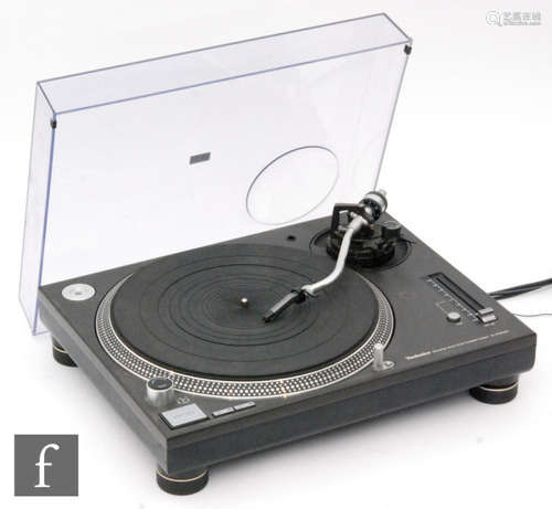 A Technics quartz direct drive SL-1210 M3D turntable, with original lid.